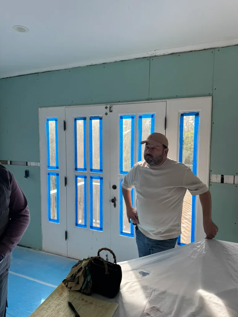Leo, Director of Operations at Forma Homes, overseeing masking and protection at a Brentwood kitchen remodel