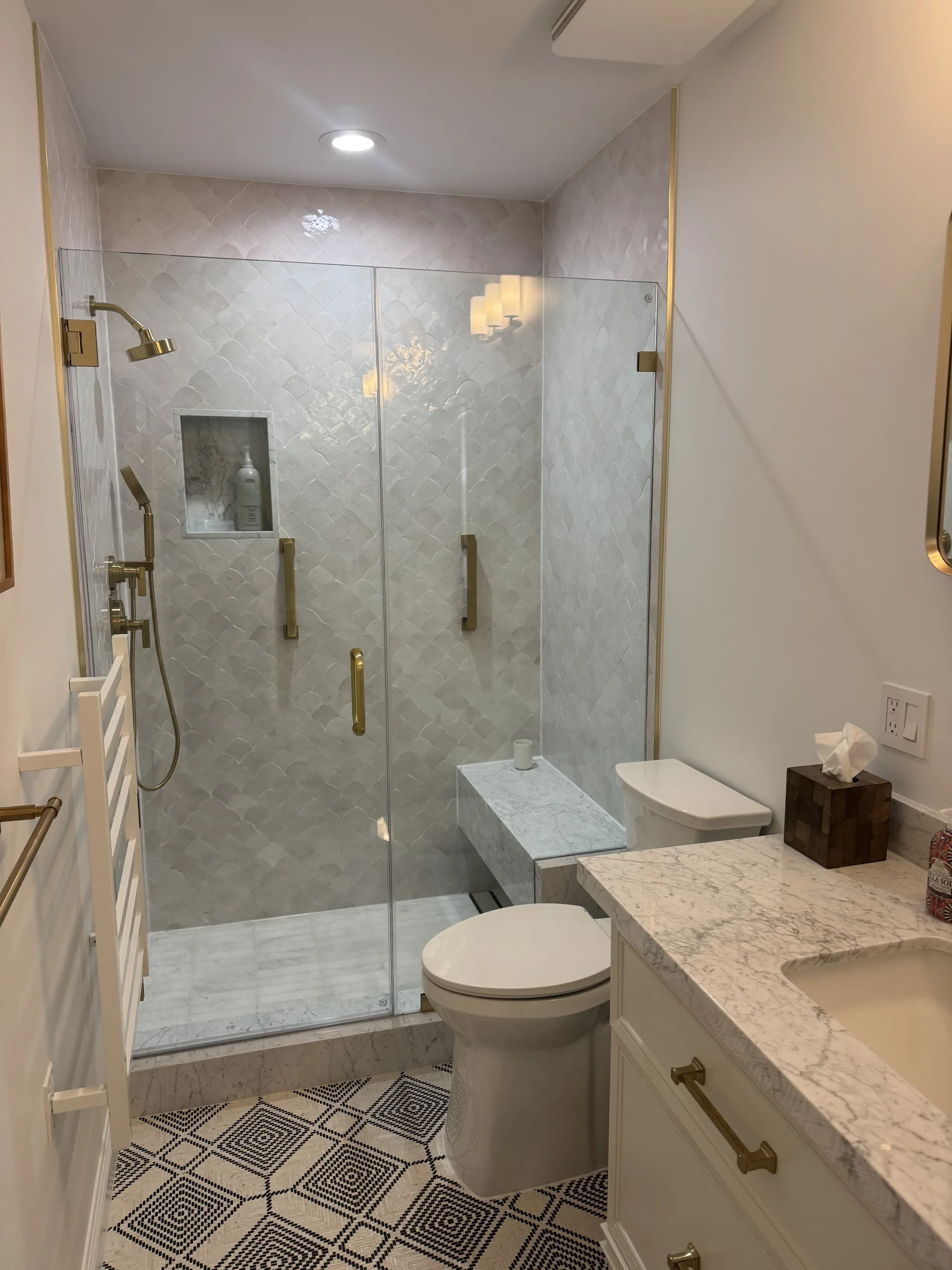Carrara herringbone shower with Zellige accent in a West Hollywood bathroom remodel by Forma Homes